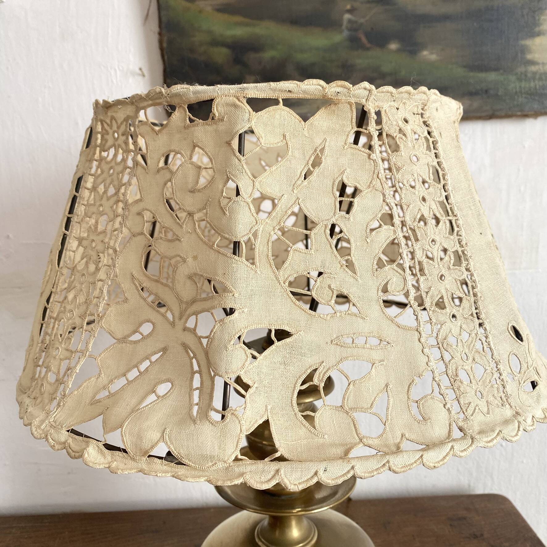 Antique brass lamp with embroidered openwork shade.