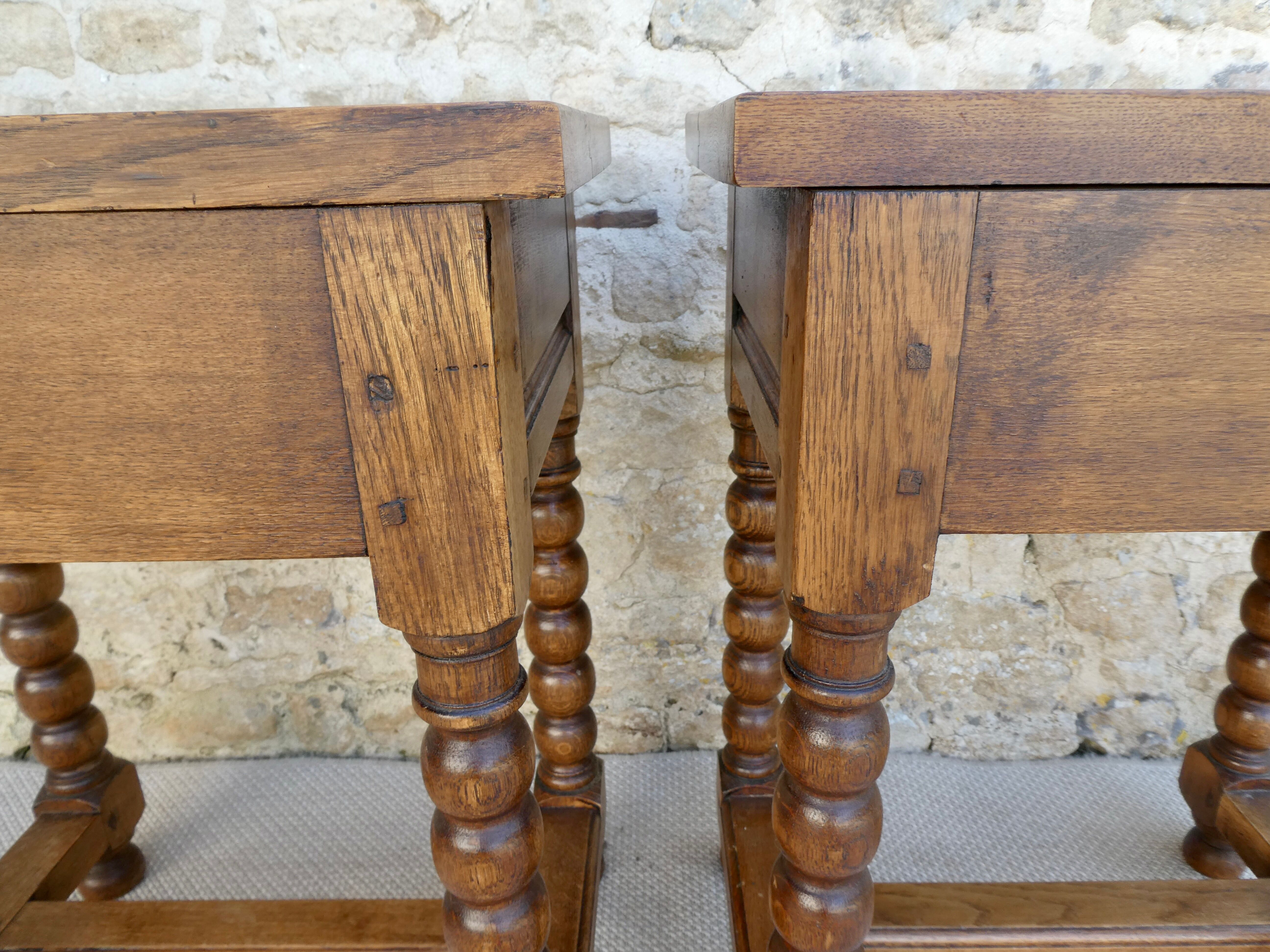 Pair of solid oak bedside tables with carved legs