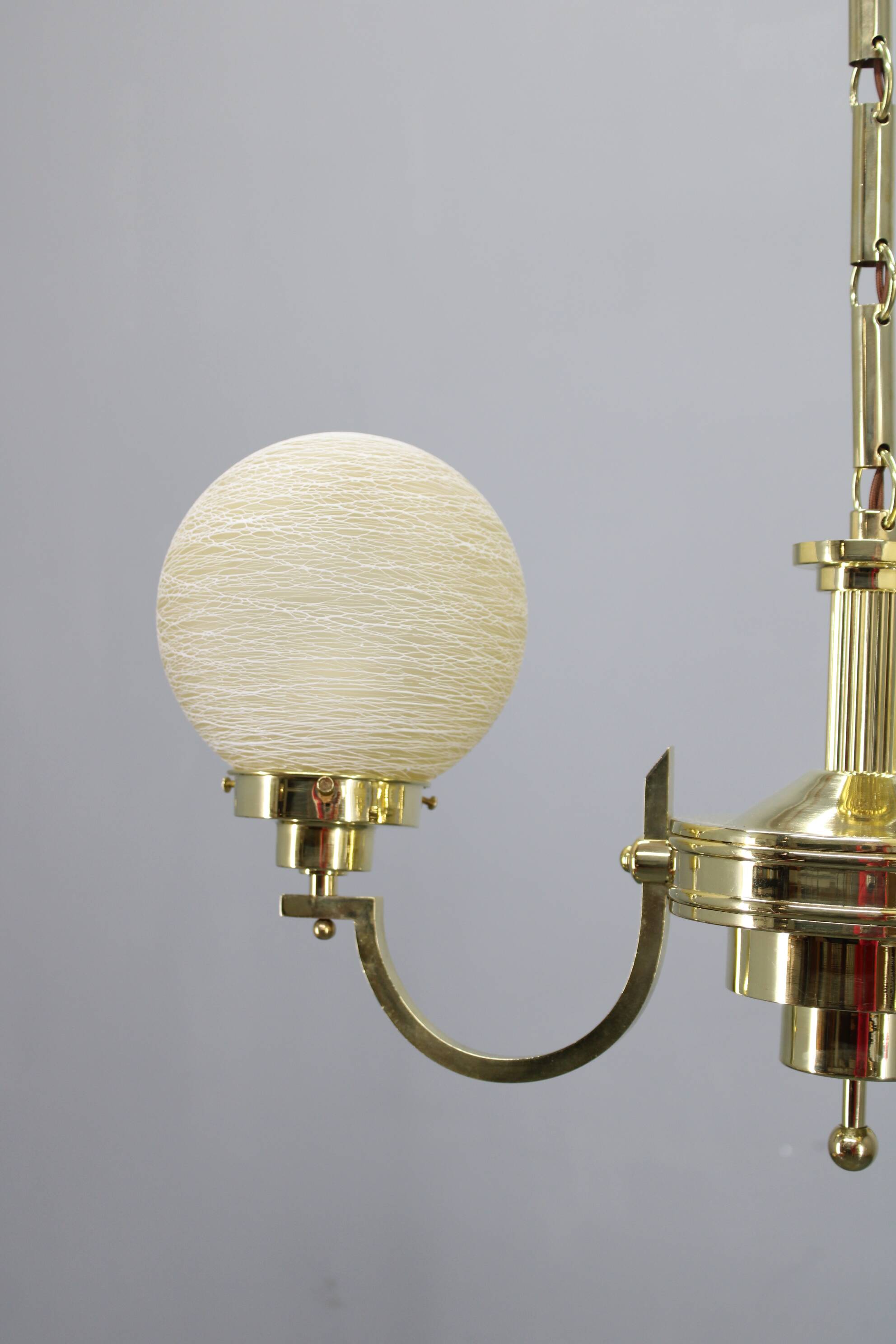 1930s Art Deco brass chandelier with textured glass globes, Czechoslovakia