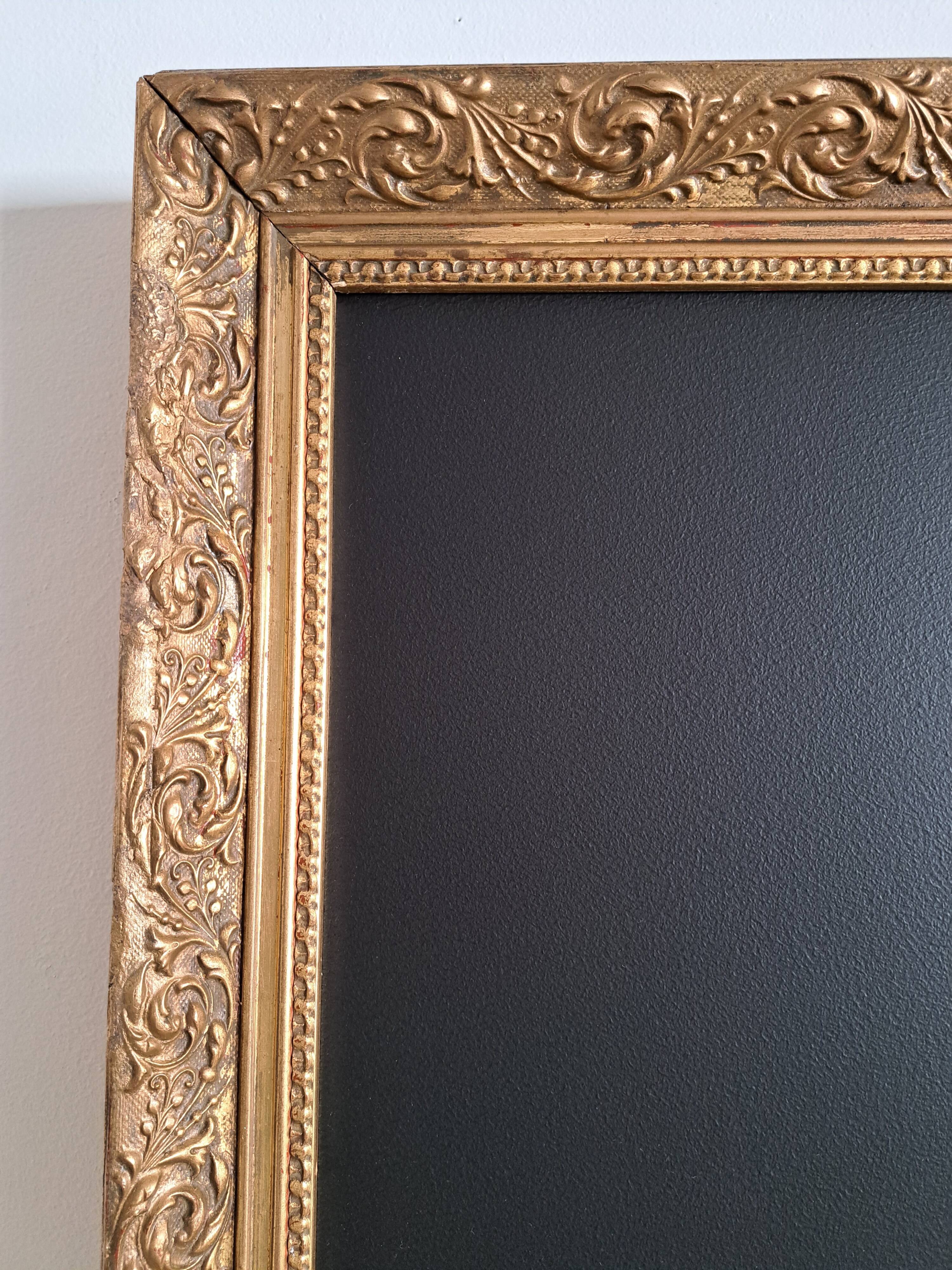 Slate table framed in gold leaf style