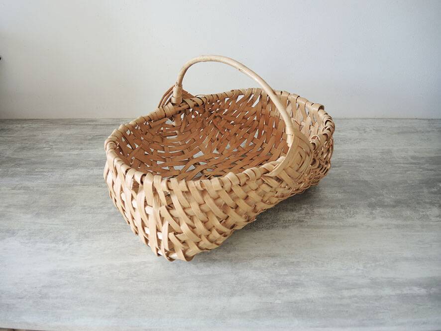 Old wicker basket / woven light leaves