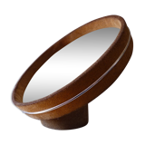 Round mirror on inclined cylindrical support