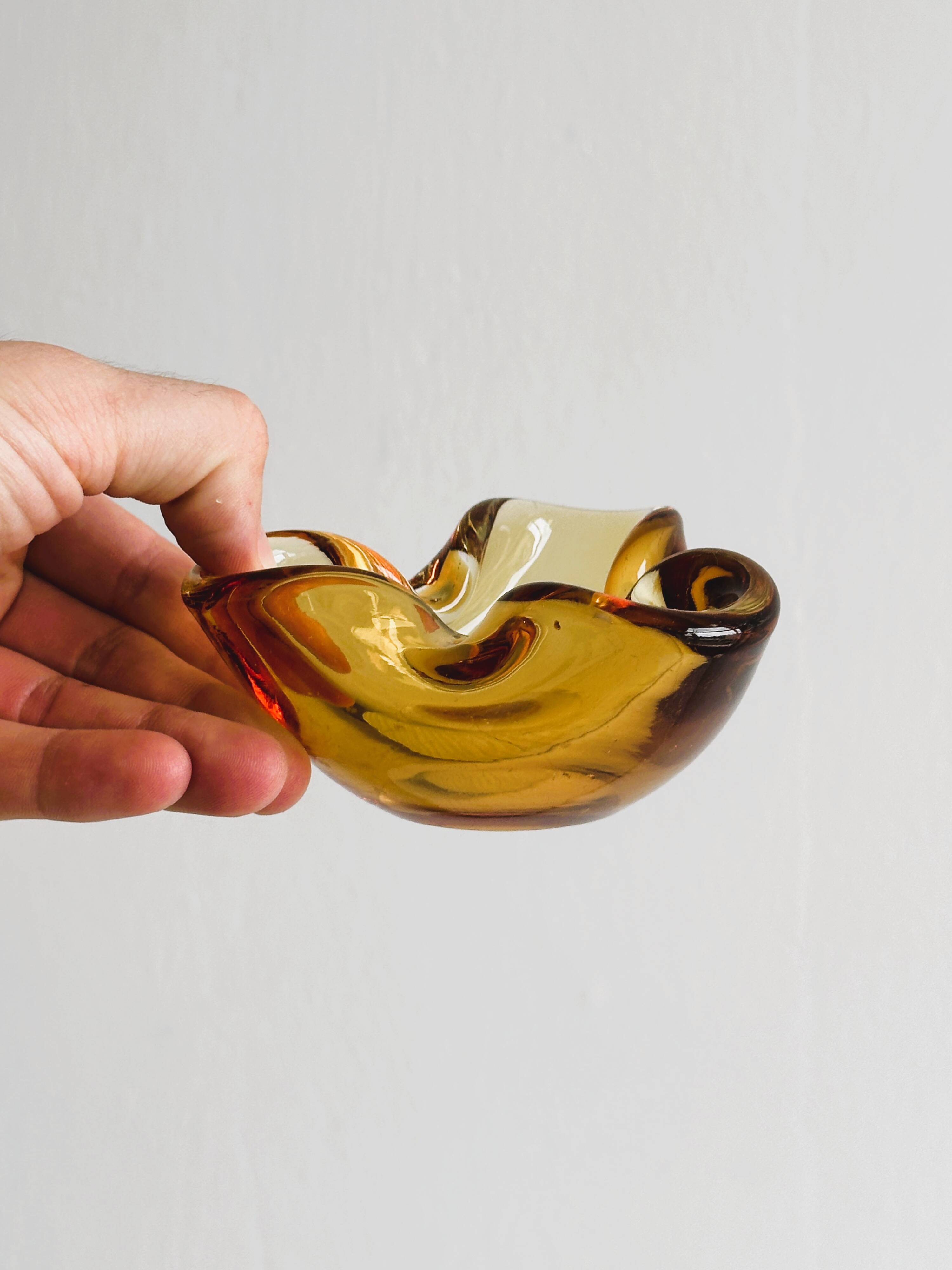 Thick amber yellow glass ashtray