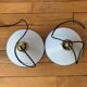 Old pair of white industrial metal suspensions with black border