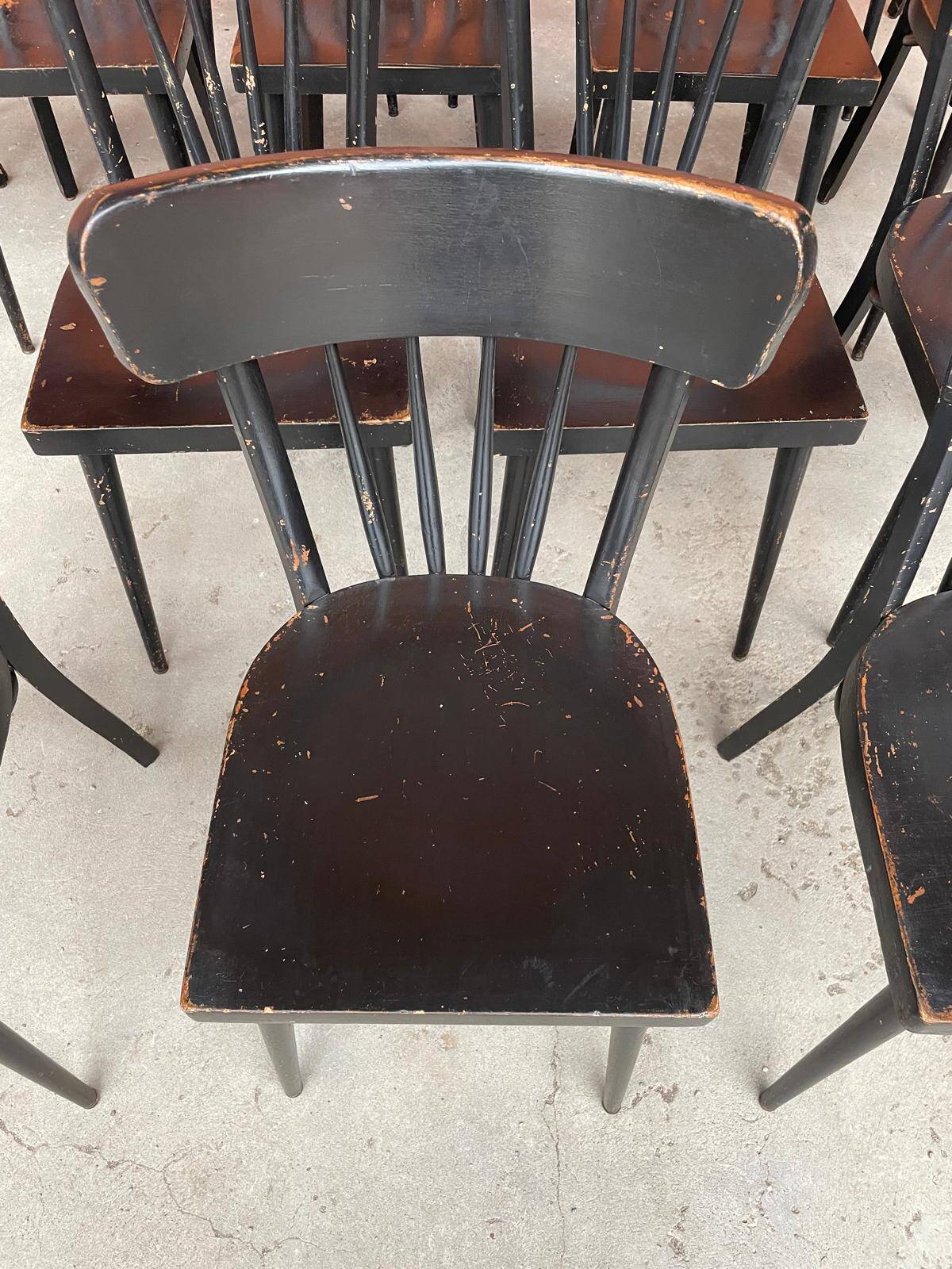 Set of 18 curved wooden bistro chairs with patina from the 60s