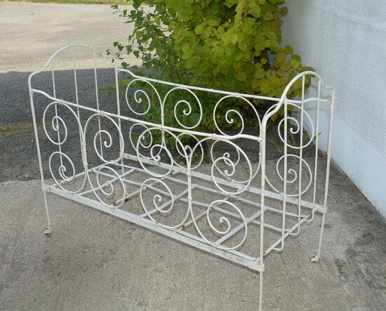Old white wrought iron child bed