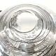 Textured oval blown glass vase with black and white glass spaghetti.