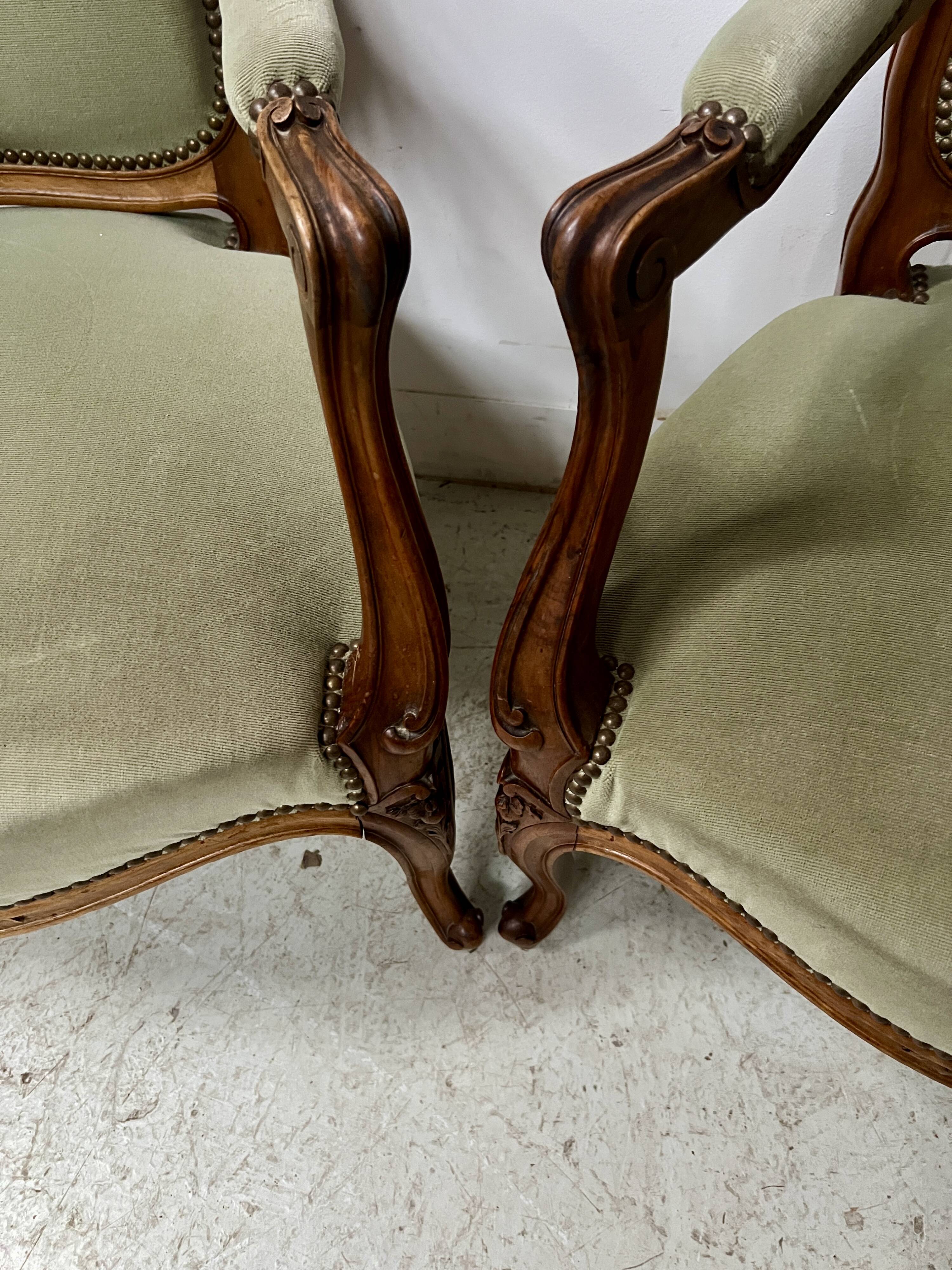 Pair of Louis XV style armchairs in solid walnut, 20th century.