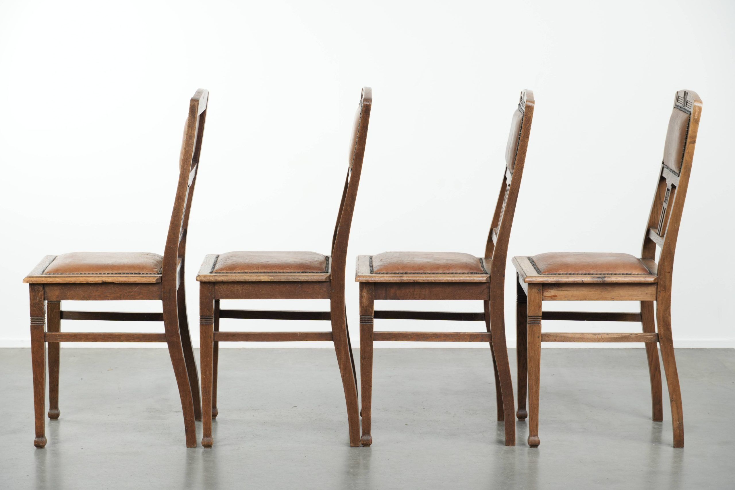 Set of 4 antique oak dining chairs in Art Nouveau style with sheepskin