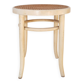 Antique stool in wood and cream caning.