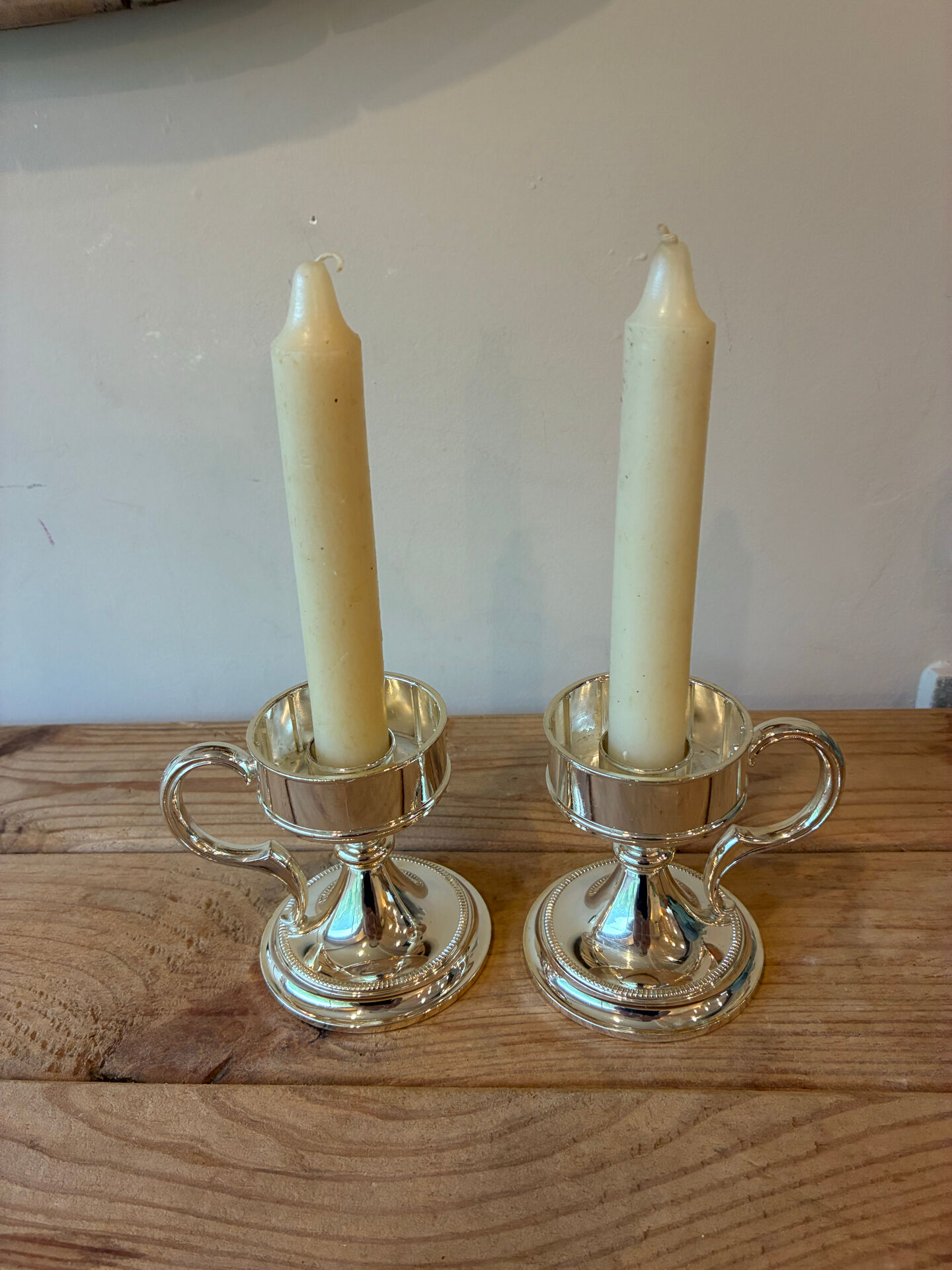 Pair of vintage silver-plated candlesticks with handles