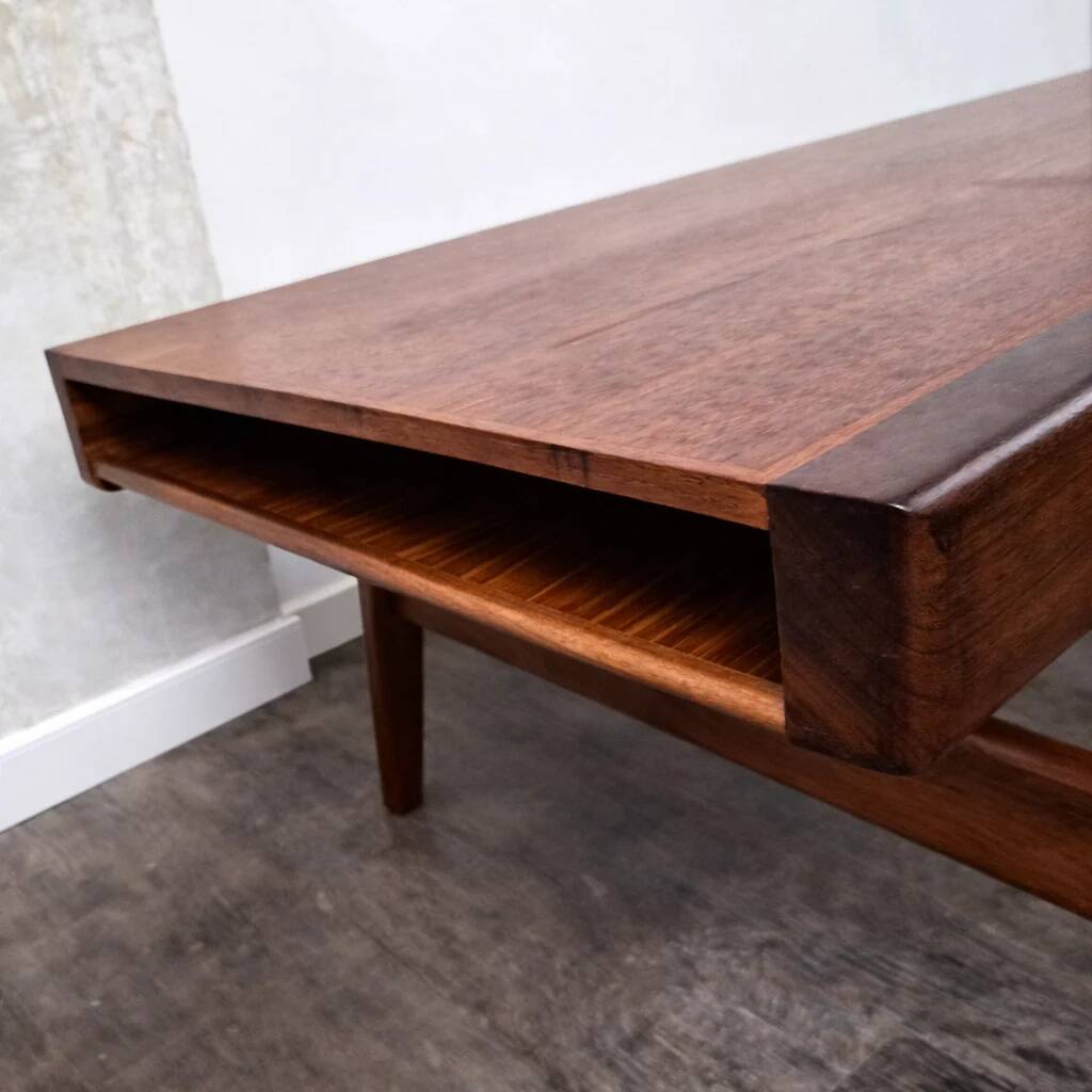Teak coffee table with opening and drawer by Johannes Andersen for Uldum Møbelfabrik, Denmark, 1960.