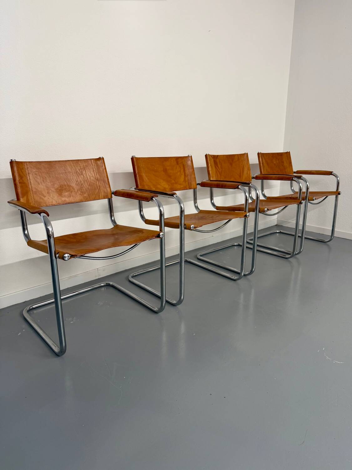 4 vintage tubular chairs with patinated leather designed by Mart Stam