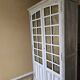 Antique library finished in white with a cerused effect.