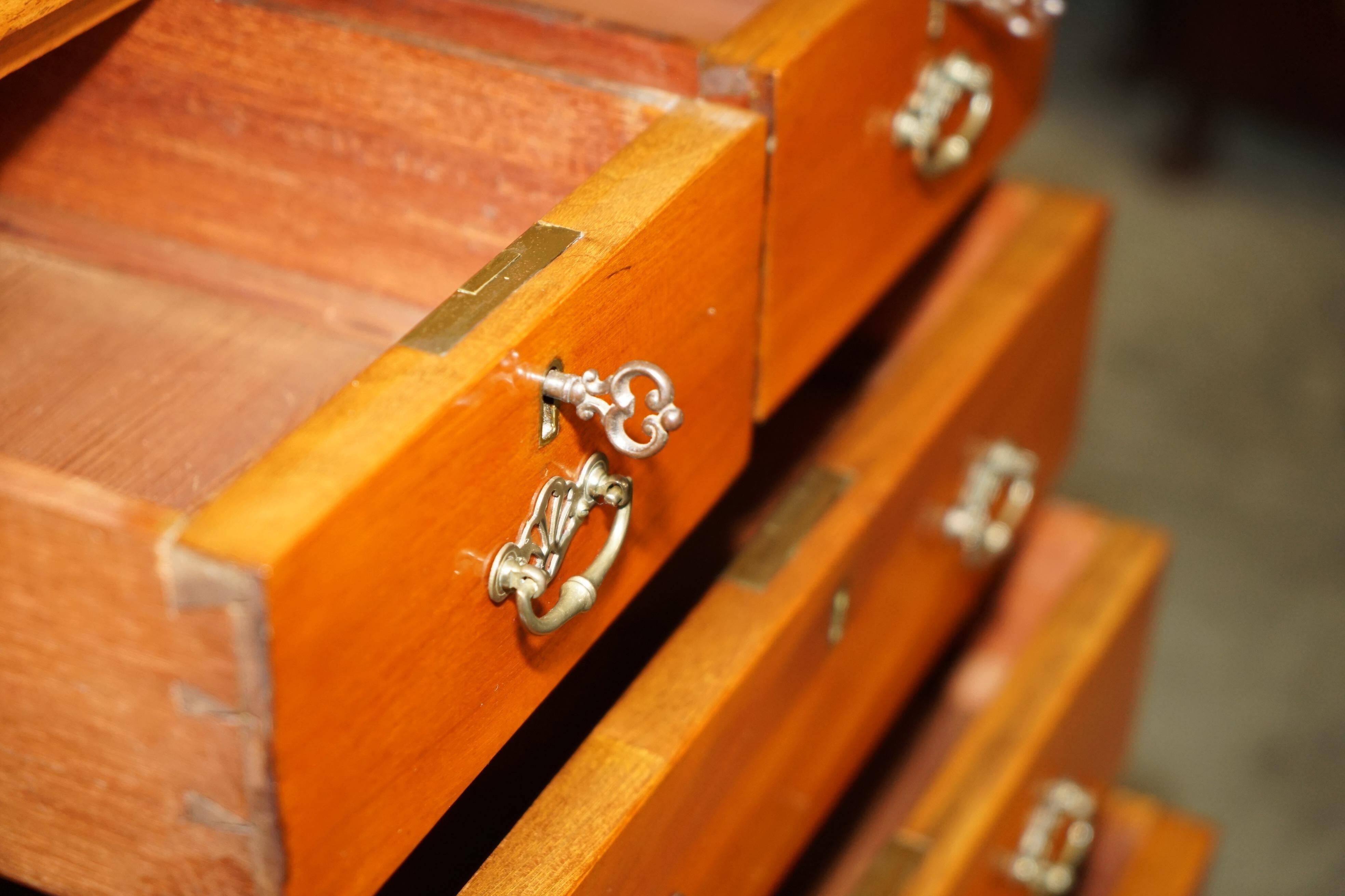 Victorian high chest of drawers in walnut with a bronze gallery.