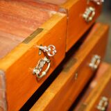 Victorian high chest of drawers in walnut with a bronze gallery.