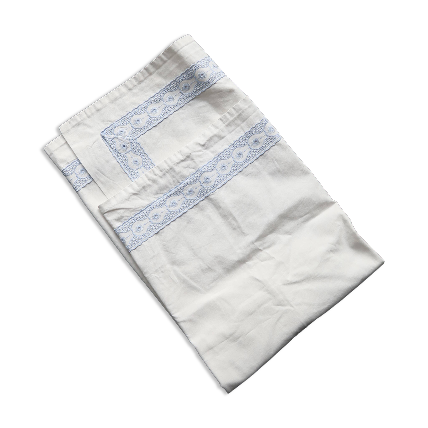 Vintage embroidered pillowcase with light blue thread.