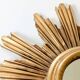 Vintage sunburst mirror in wood and gold resin, 1960s–70s