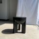 Black mango wood tripod side table with a semi-spherical top, height: 45 cm, diameter: 44 cm.