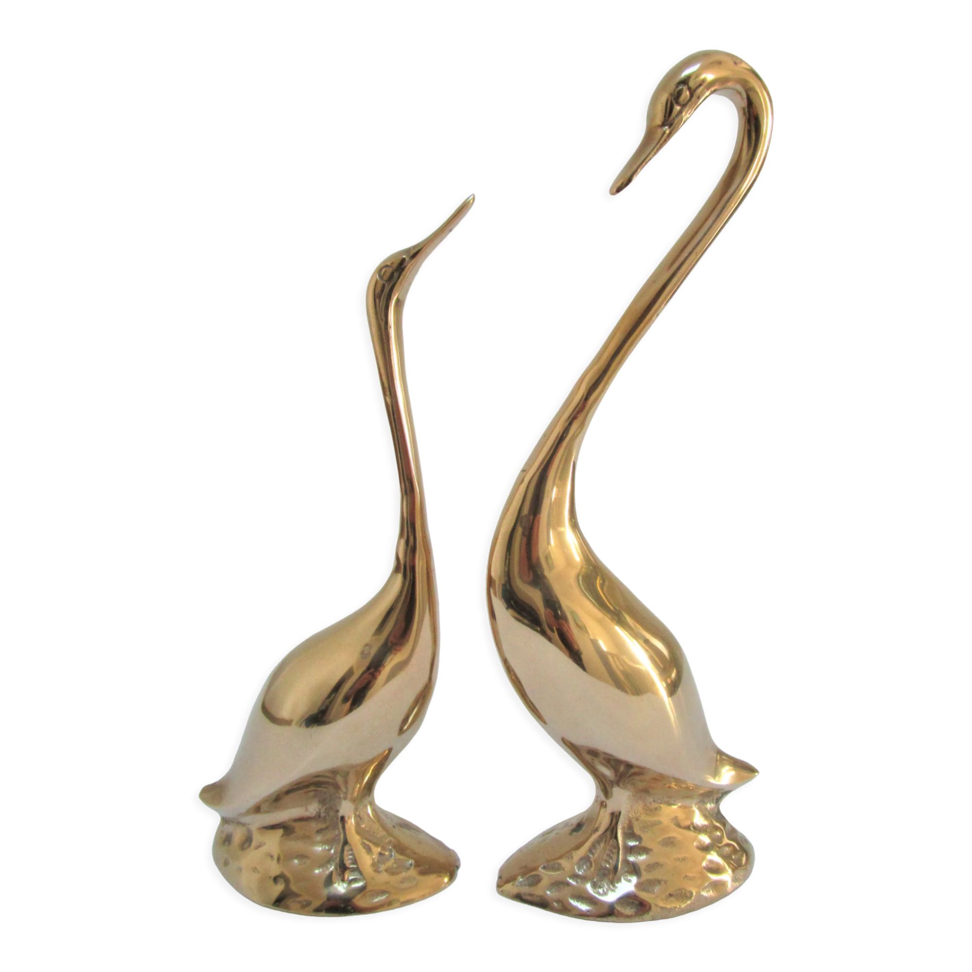Pair of stylized birds in solid brass