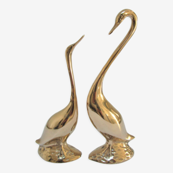 Pair of stylized birds in solid brass