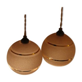 Set of two Art Deco pendant lamps in pink and gold glass