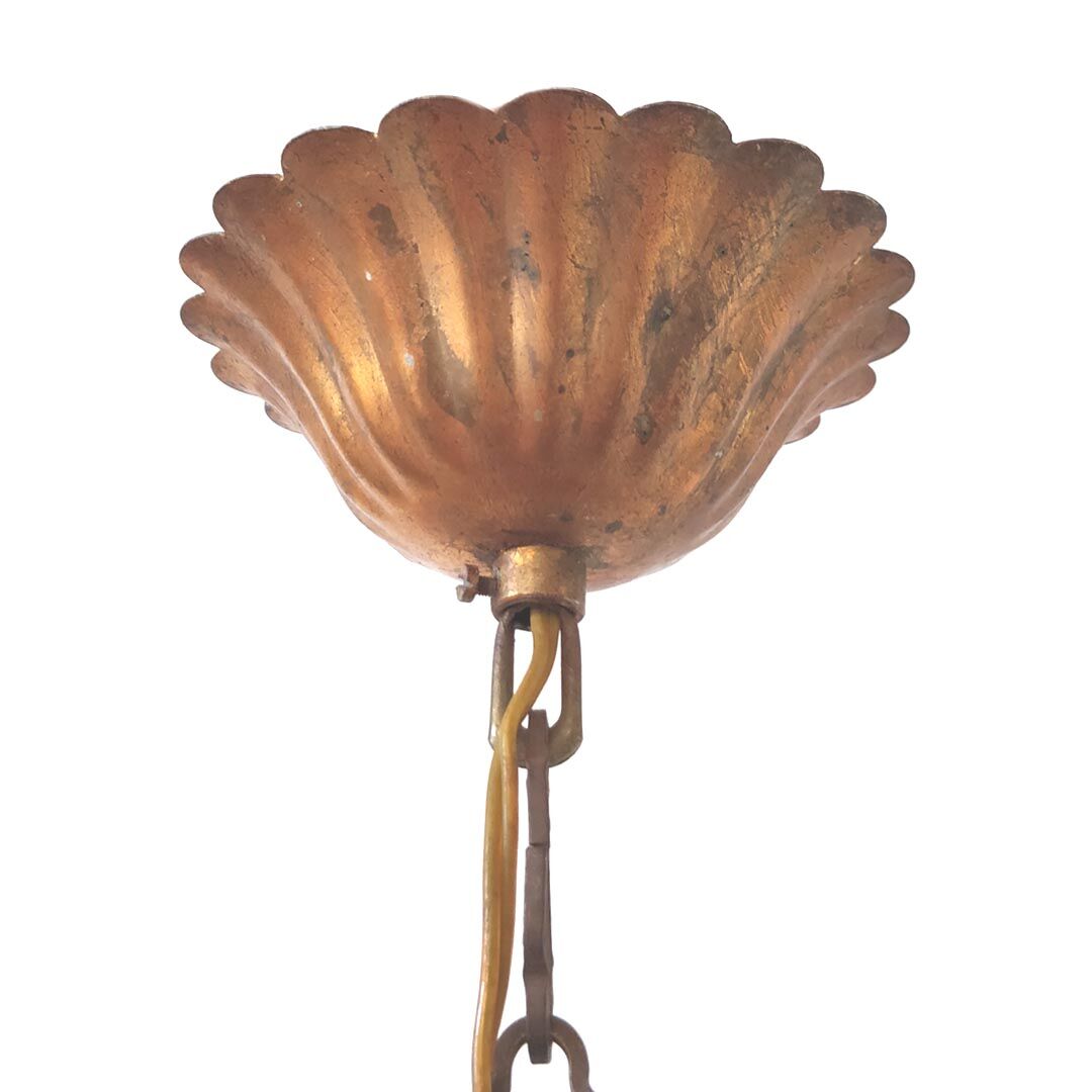 Golden metal chandelier palm leaves