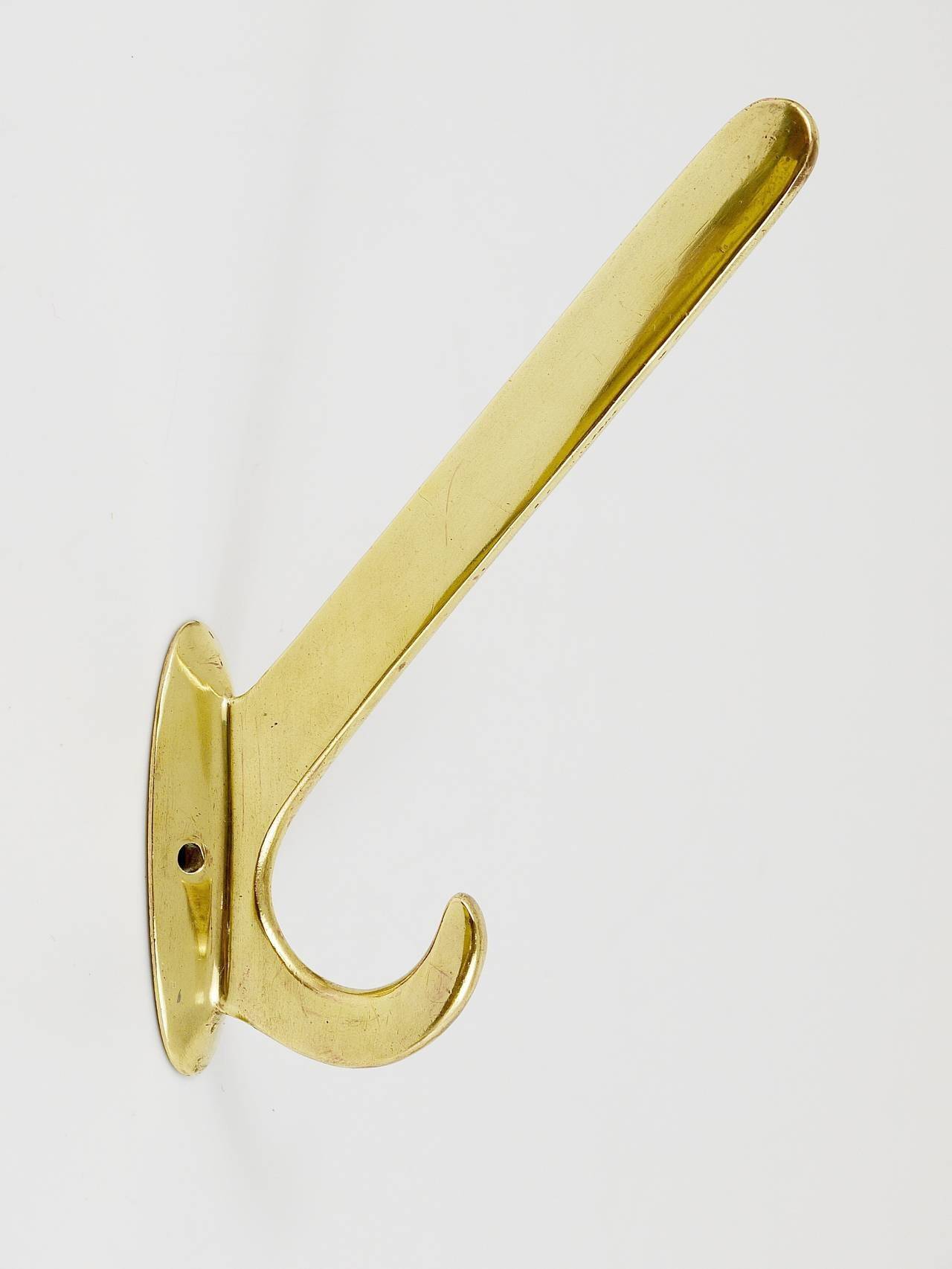 Four handmade brass wall hooks in Art Nouveau style, Austria, 1920s.