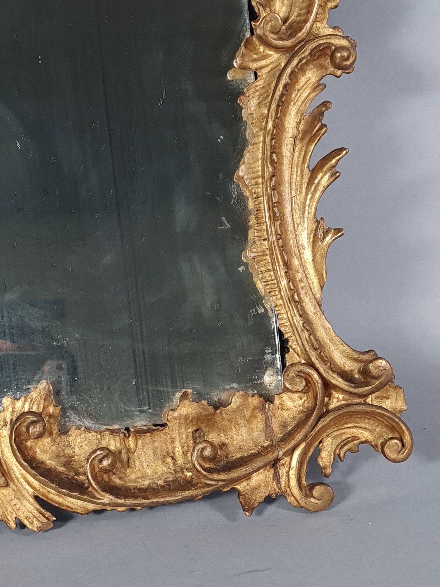 Mirror circa 1800, carved and gilded wooden frame, rocaille decoration, 54x39 cm, C227
