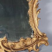 Mirror circa 1800, carved and gilded wooden frame, rocaille decoration, 54x39 cm, C227