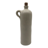 Old hot water bottle in glazed stoneware, gray color.