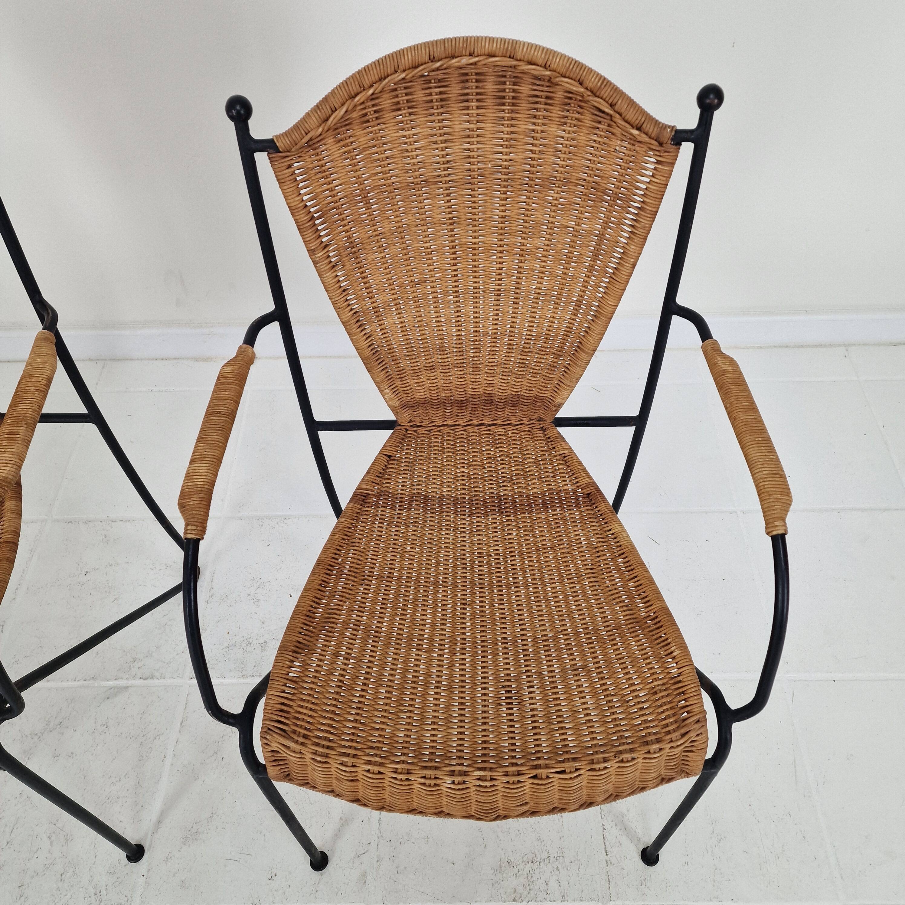 Pair of wicker and iron armchairs by Frederic Weinberg, United States, 1950s.