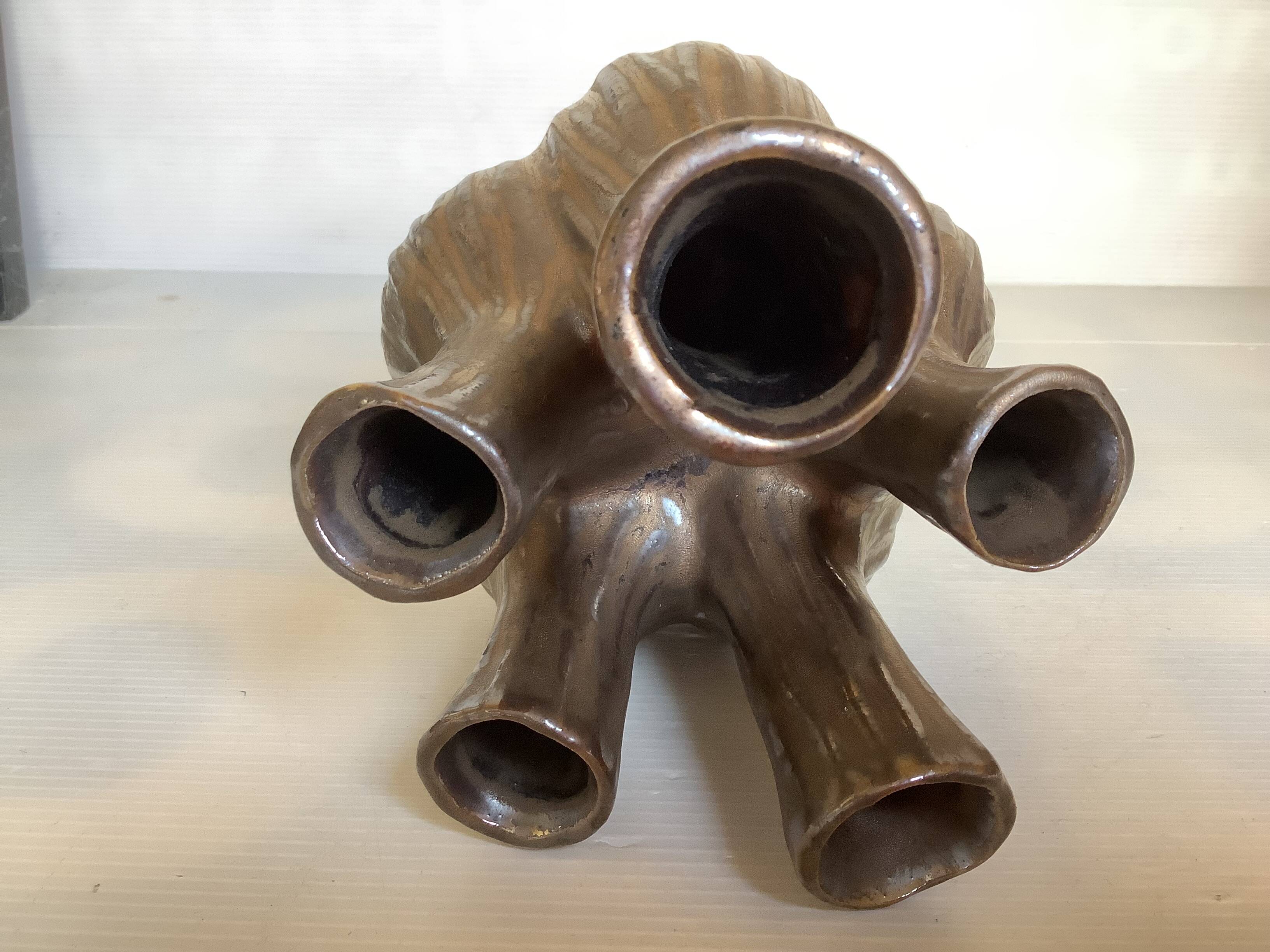 Tulip vase with ceramic flowers in brown and gold.