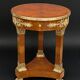 Circular gueridon empire of the 19th century in marquetry ornamented with gilt bronze