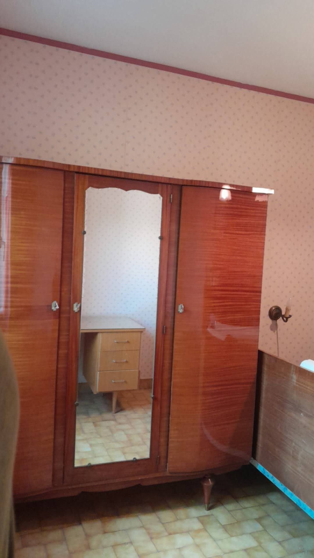 Large vintage wardrobe from the 50s/60s in wood with a mirror.