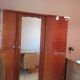 Large vintage wardrobe from the 50s/60s in wood with a mirror.