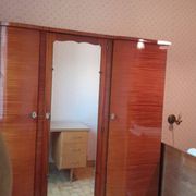 Large vintage wardrobe from the 50s/60s in wood with a mirror.