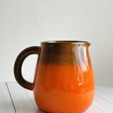 Orange ceramic pitcher
