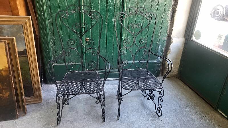 Pair of black wrought iron armchairs