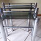 Pull-out tables in glass and metal 80 years