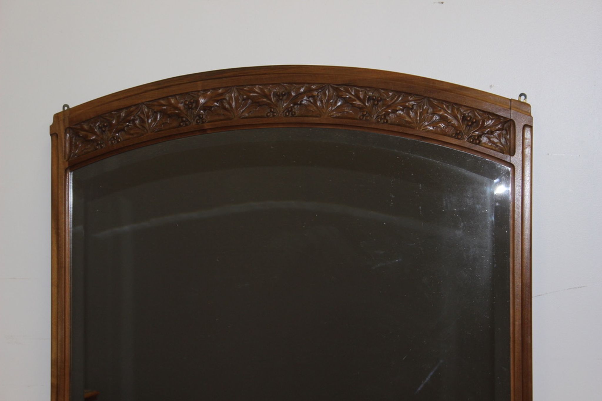 Art Nouveau walnut mirror decorated with holly leaves circa 1900 105x171cm