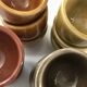 Set of 12 small multi-colored ceramic candle holders