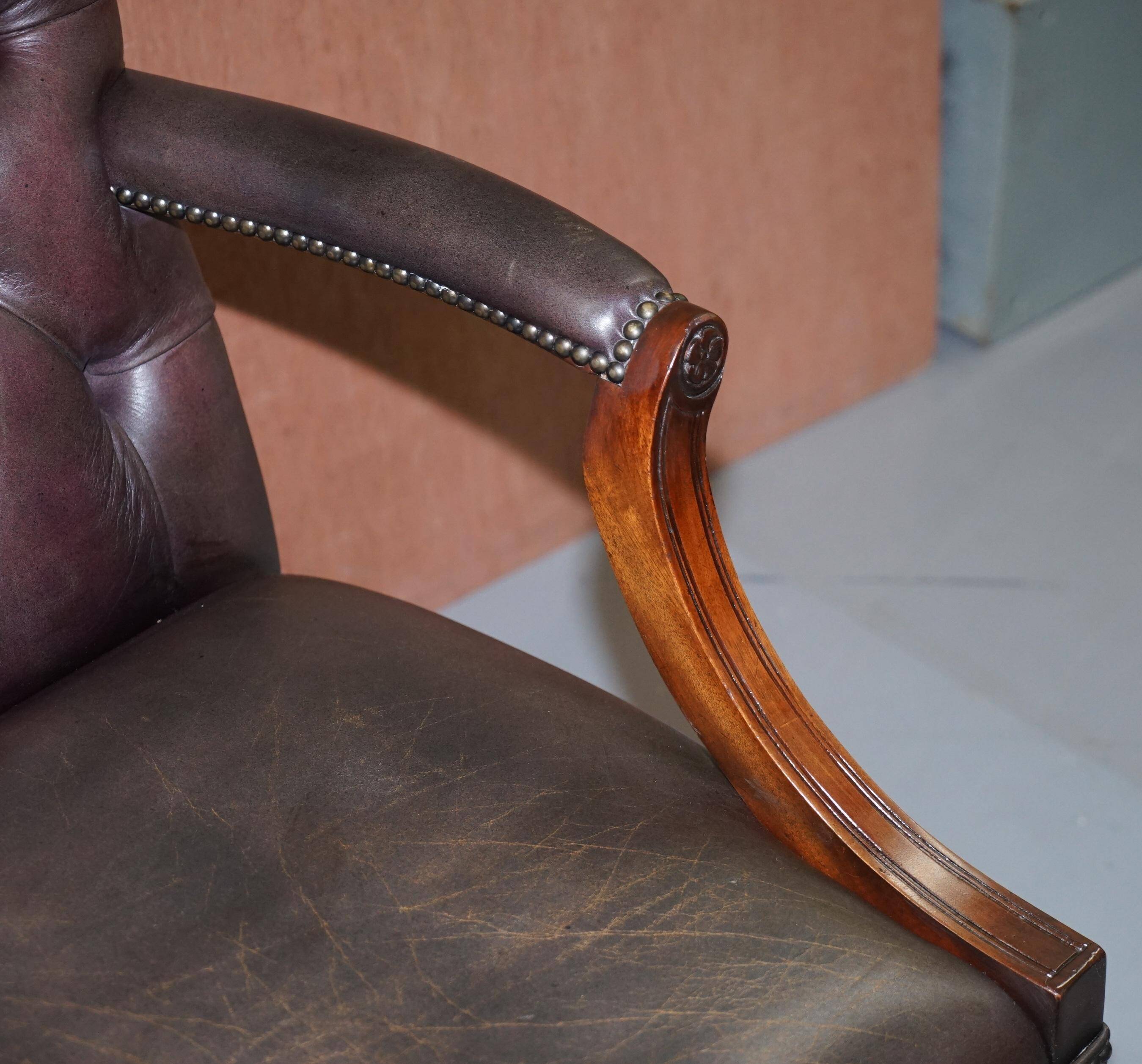 Gainsborough armchair George II leather Chesterfield hand-carved with claw and ball feet.
