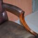 Gainsborough armchair George II leather Chesterfield hand-carved with claw and ball feet.