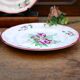 Three small hand-painted Saint-Clément dinner plates.