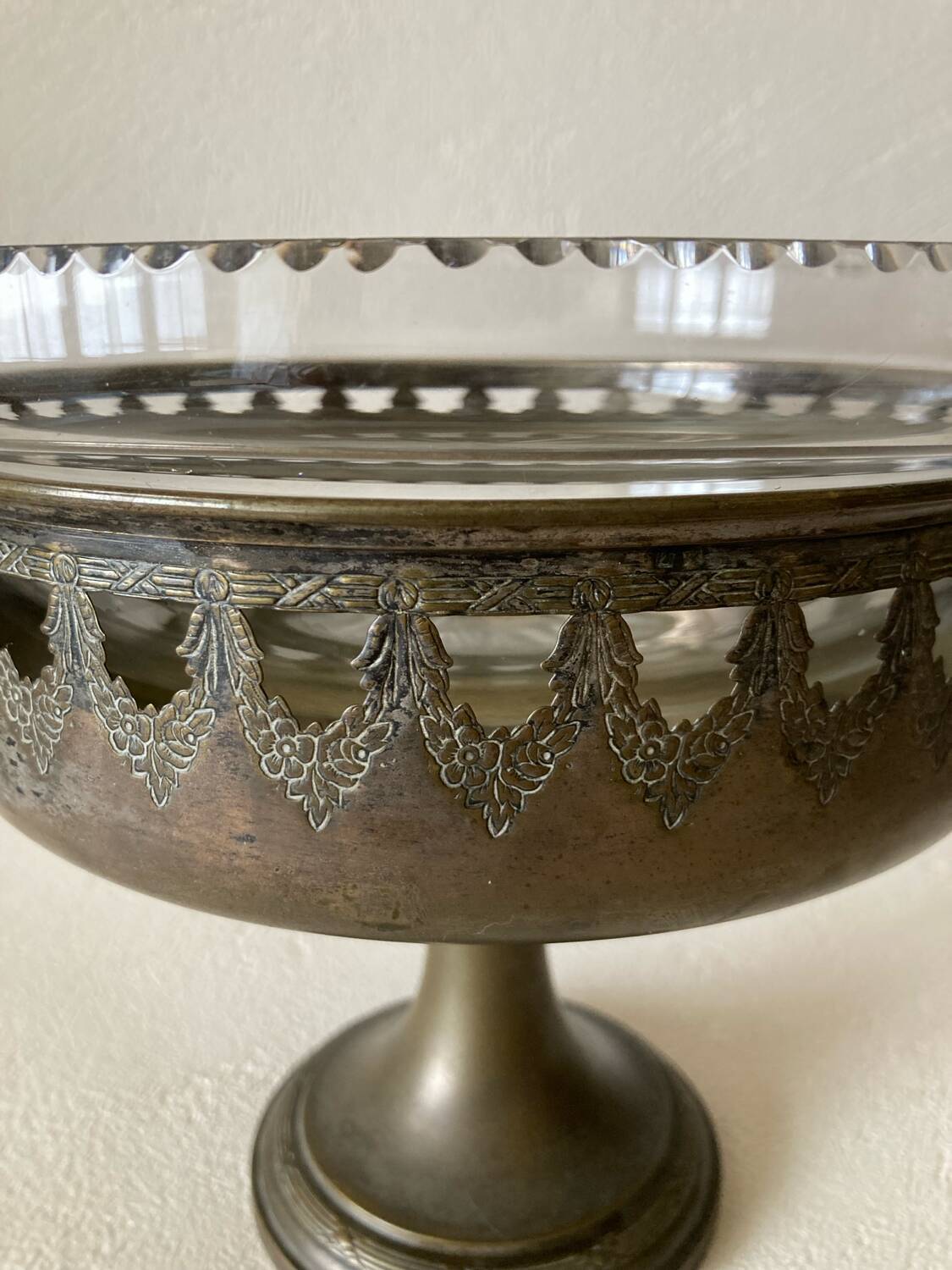 Antique crystal fruit bowl on a brass pedestal