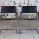 Pair of Bauhaus cantilever armchairs in chromed metal and leather, 1970