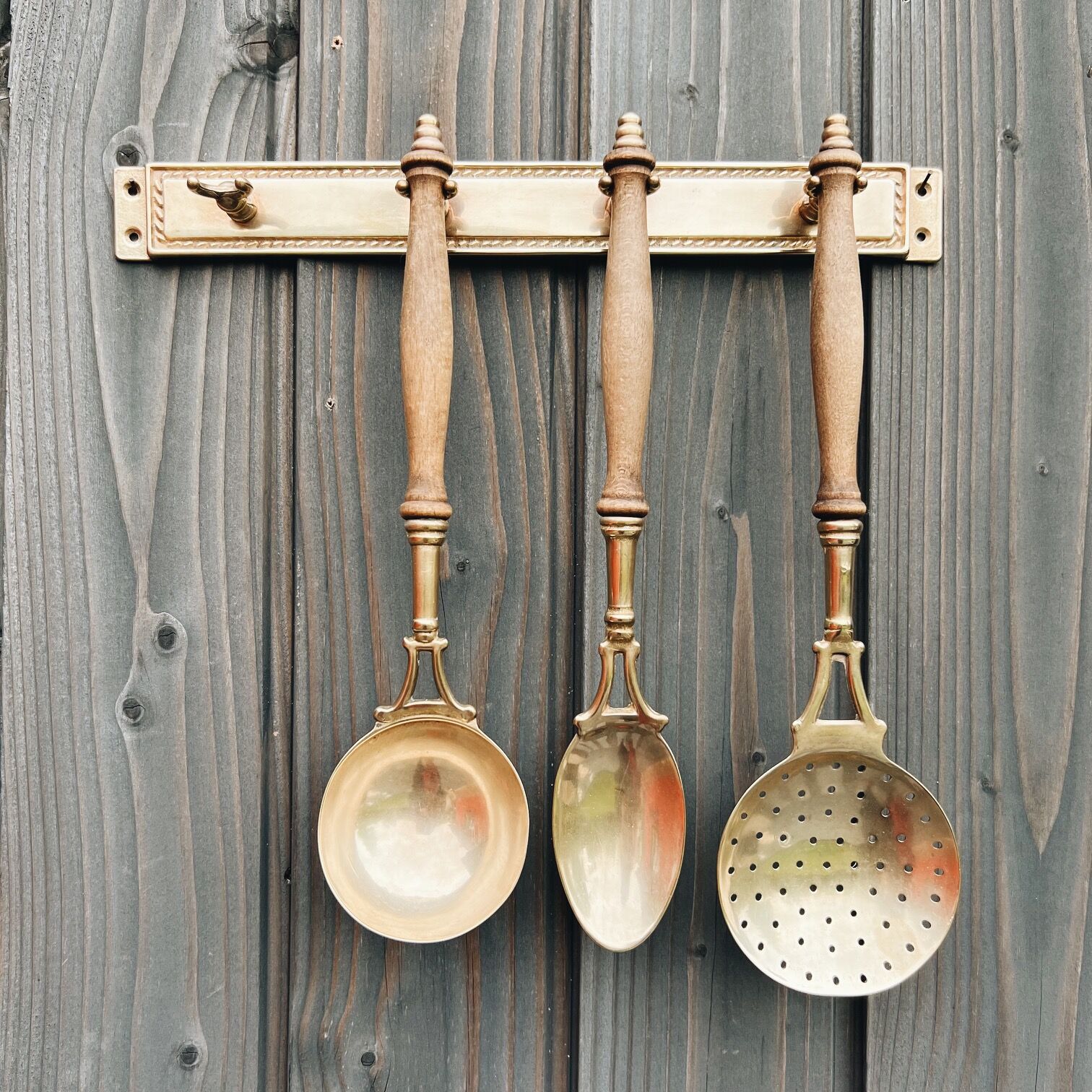 Brass holder with 3 brass & wood utensils
