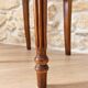 Antique Louis XVI style chair in wood and floral fabric.