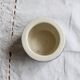 Vintage ceramic cache-pot with navy blue gingham pattern.